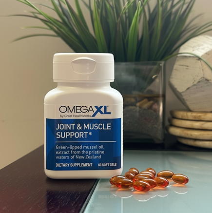 Omega XL Joint & Muscle Support supplement bottle with capsules on a surface.